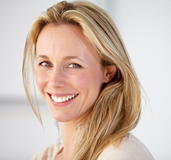 middle age woman with blonde hair and smooth facial skin